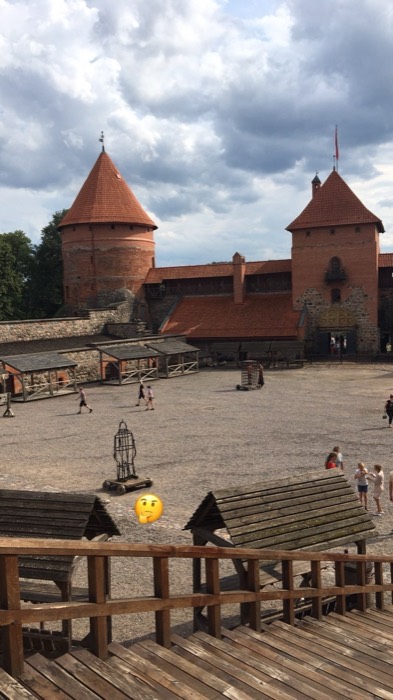 Trakai Castle red-brick towers and courtyard from wooden stands