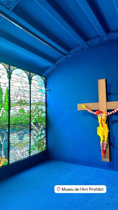 Crucified Ronald McDonald artwork in blue room, Museu de l'Art Prohibit