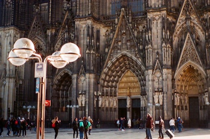 Cologne Cathedral facade on 35mm film, globe lamps and tourists