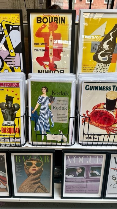 Rack of vintage poster prints: Kodak, Guinness, Vogue, Basquiat