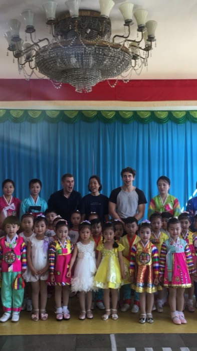 Joshua: group photo with North Korean kindergarten kids in colorful hanbok