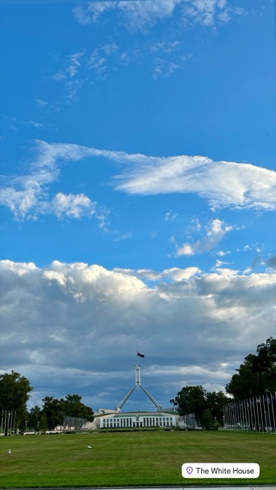 Parliament House Canberra under huge sky, jokingly tagged The White House