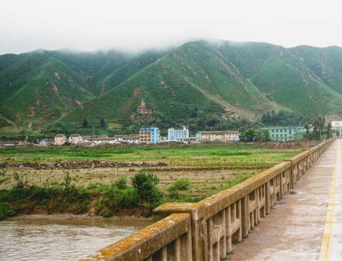 Crossing 1940s Japanese-era bridge on foot into Onsong, DPRK