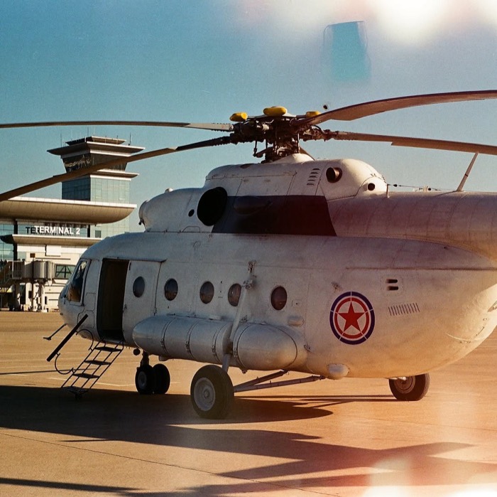Soviet Mi-8 helicopter on tarmac at Pyongyang airport, 35mm light leaks