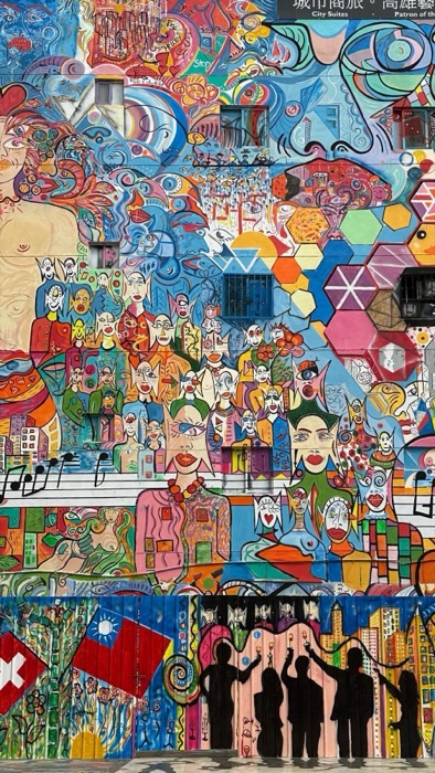 Huge colorful psychedelic mural covering building facade, Taiwan flag detail