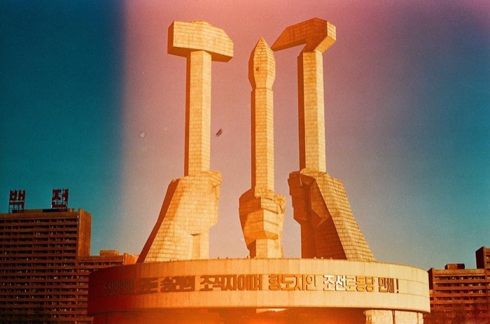 Broken 35mm film glitch over Monument to Party Founding, stunning colors