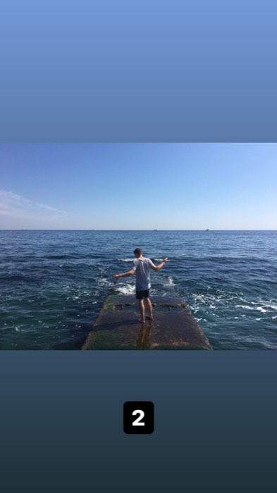 Joshua: balancing arms-out on submerged concrete pier in the Black Sea