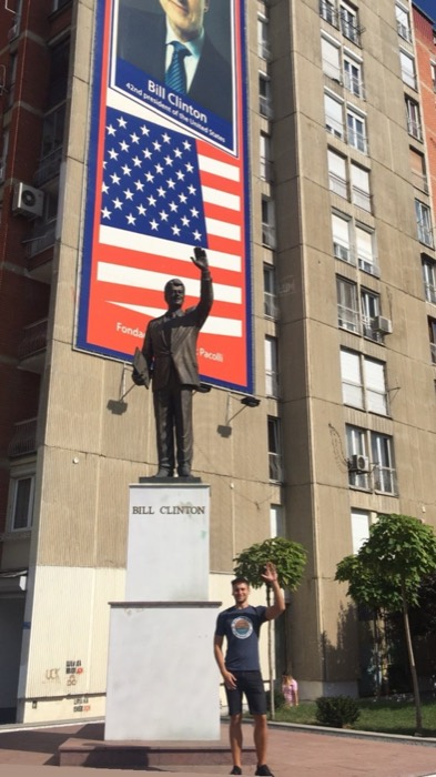 Joshua: mimicking wave of Bill Clinton statue on Bill Clinton Boulevard