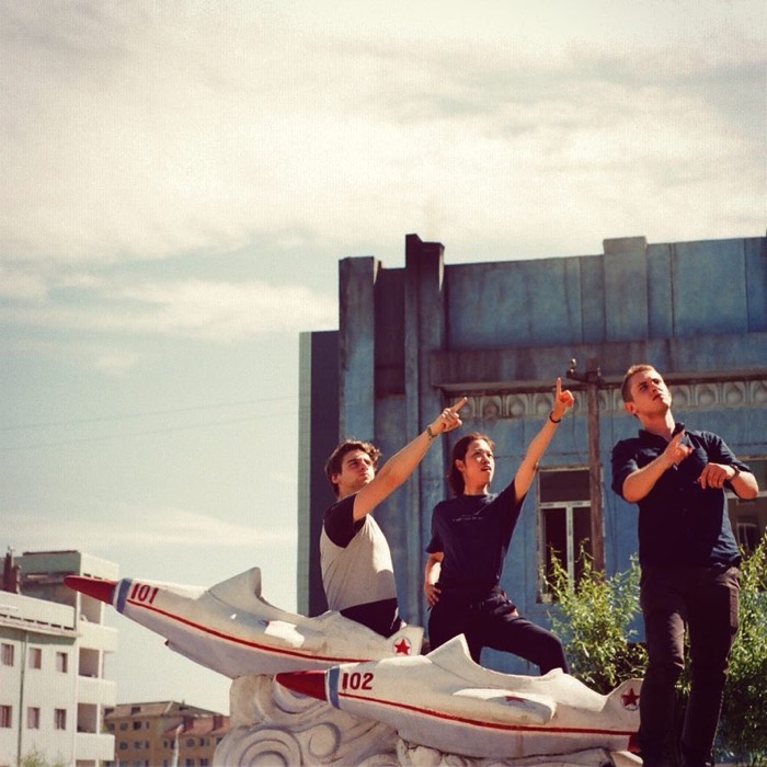 YPT tour mates pose atop jet-fighter monument in North Korean kindergarten playground, 35mm