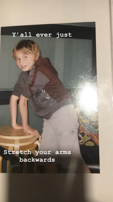 Joshua: goofy childhood print, blonde kid leaning on stacked stools
