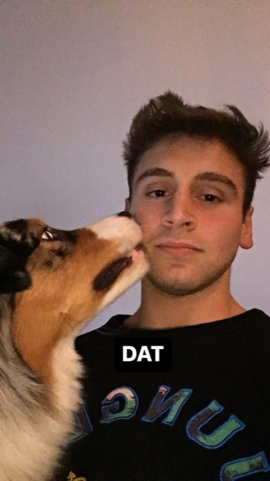 Joshua: selfie while Australian Shepherd dog licks his cheek