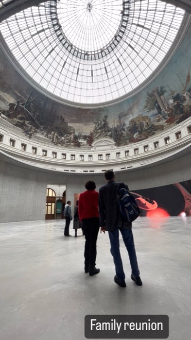 Bourse de Commerce rotunda, glass dome and frescoes, family visiting