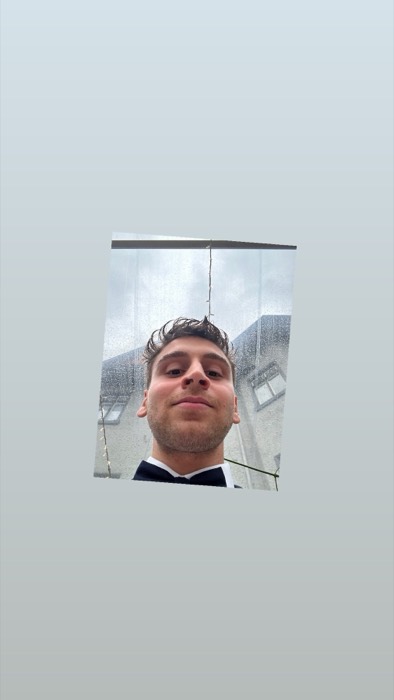 Joshua: bow-tie selfie inside rainy clear wedding marquee