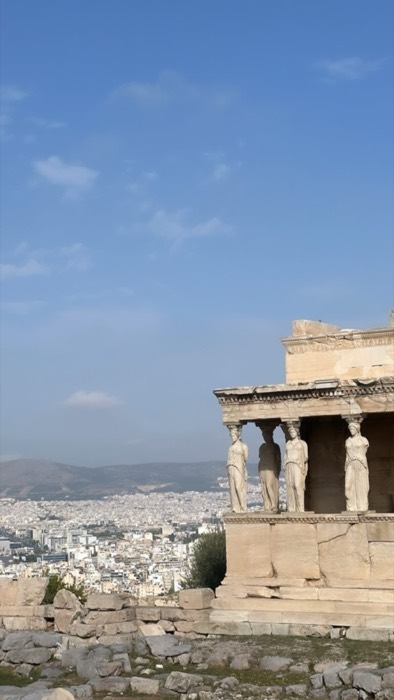 Erechtheion Caryatid porch on Acropolis with Athens sprawling below