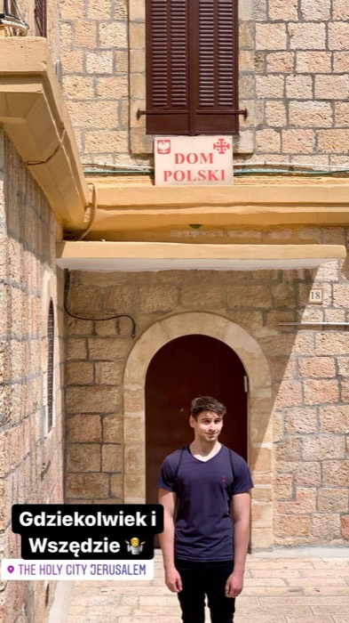 Joshua: posing under Dom Polski sign in Jerusalem Old City