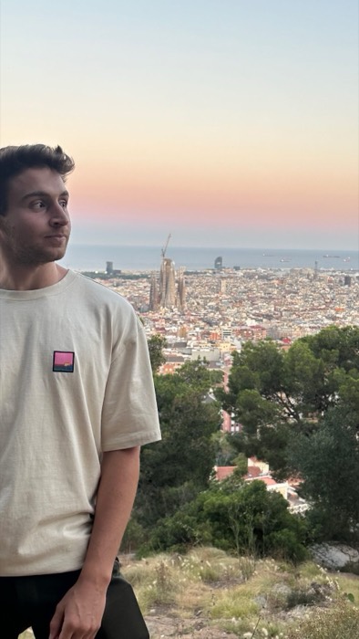 Joshua: sunset portrait above Barcelona skyline with Sagrada Familia behind