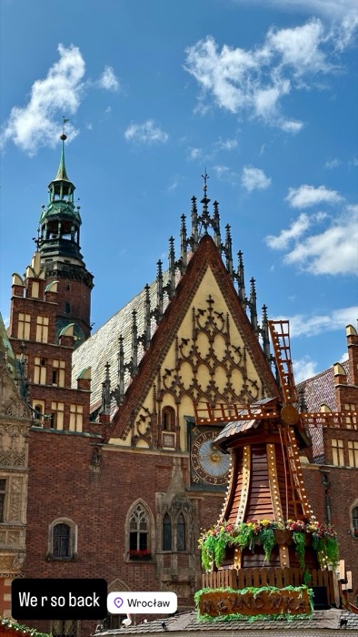 Gothic Wroclaw Town Hall facade with decorative windmill, blue sky