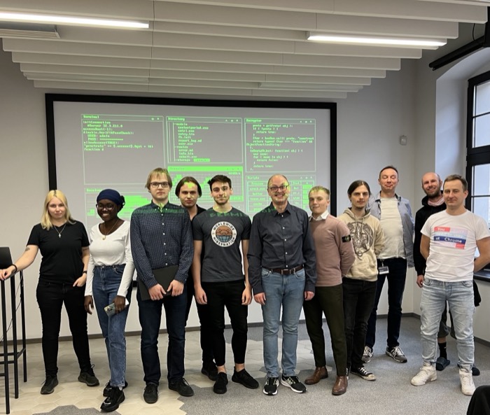 Security workshop group photo before terminal-screen projection