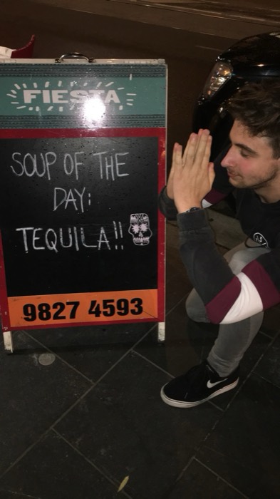 Joshua: praying to a 'Soup of the day: Tequila' Fiesta sandwich board.