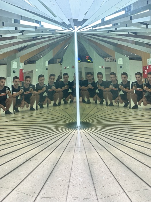 Joshua: kaleidoscopic mirror selfie multiplying his reflection many times
