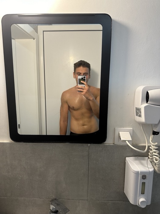 Joshua: shirtless selfie in a bathroom mirror