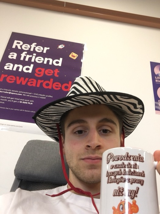 Joshua: zebra hat selfie with Polish mug at Opera office