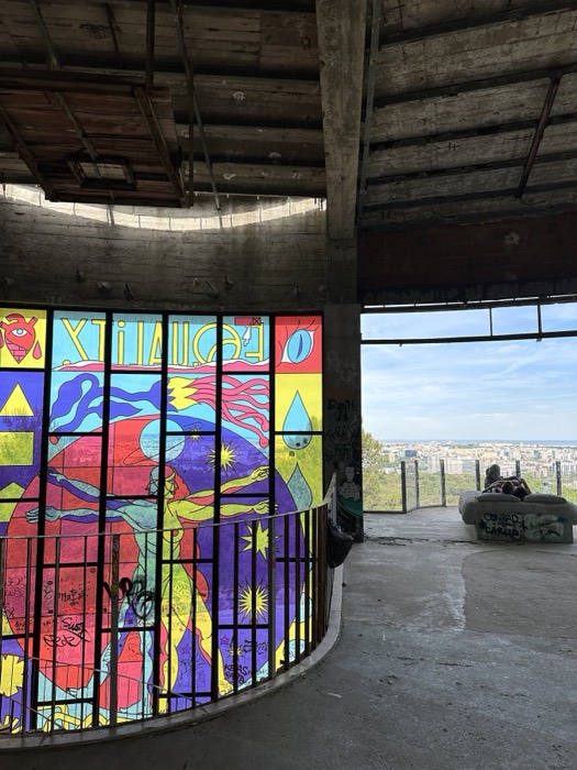 Vivid Equality stained glass and city view in Monsanto ruin