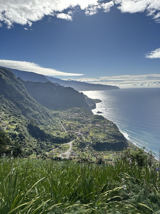 Sweeping green Madeira north coast cliffs meeting the Atlantic
