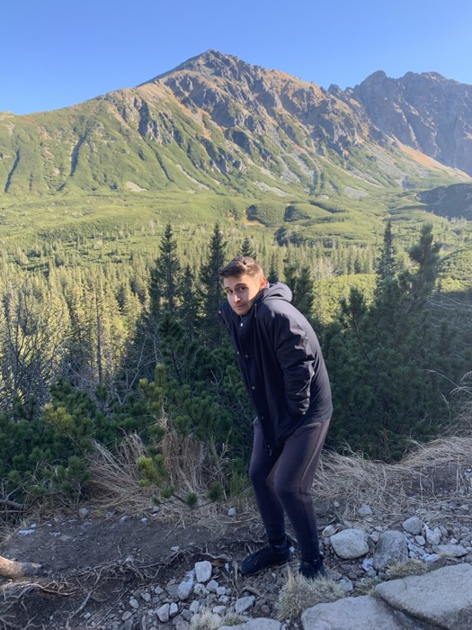 Joshua: hiking before sunlit Tatra peaks and pine valley.