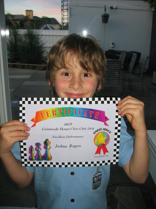 Joshua: as a child holding 2004 Grimwade House chess club certificate