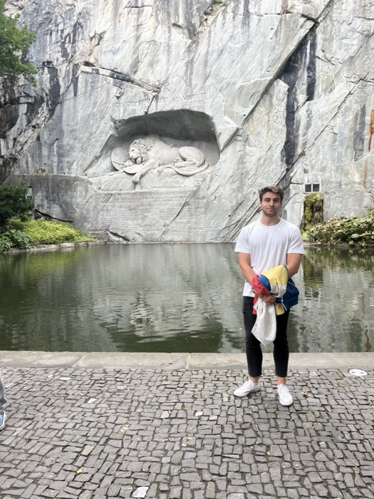 Joshua: standing before the Lion Monument carved into rock cliff