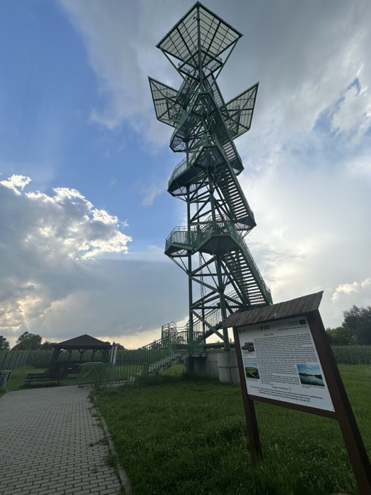 Striking green spiral observation tower in countryside park