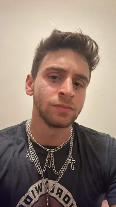 Joshua: selfie with silver chains and leftover glitter, post-party