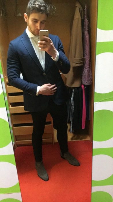 Joshua: fitting-room mirror selfie in a navy suit