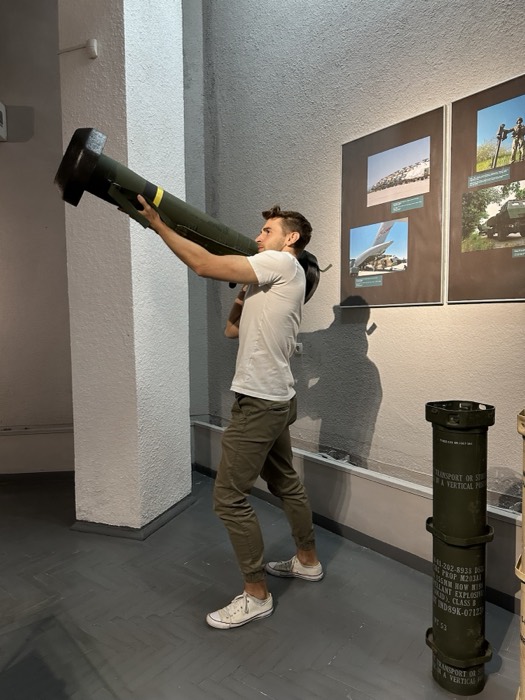 Joshua: shouldering a launcher tube like a bazooka in war museum
