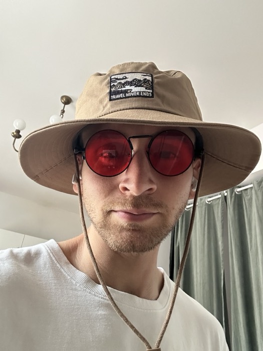 Joshua: selfie in bucket hat and red round sunglasses