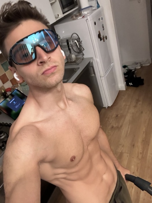 Joshua: shirtless kitchen selfie wearing mirrored sport shades