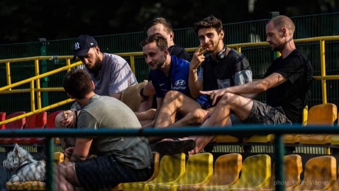 Joshua: hanging out with group of friends on stadium bleachers