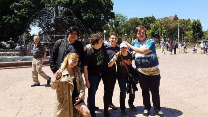Group of friends posing by Archibald Fountain in Hyde Park