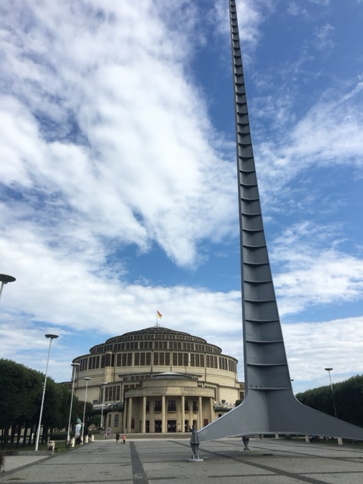 Centennial Hall and Iglica spire, Wroclaw, dramatic blue sky.