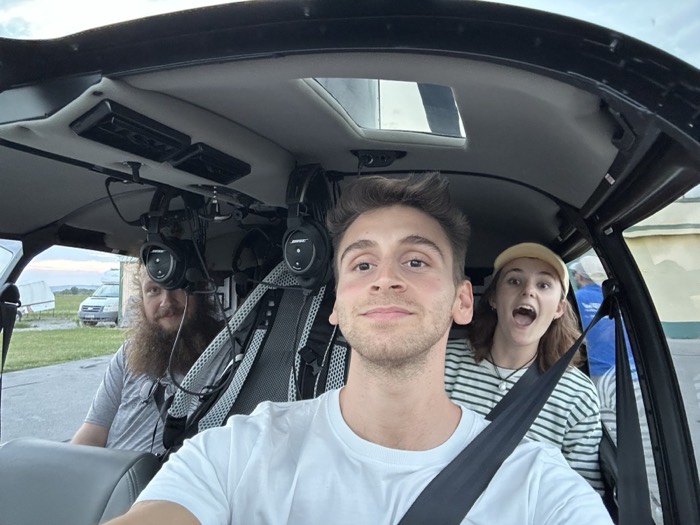 Joshua: fun selfie at helicopter controls, friend and laughing woman passenger