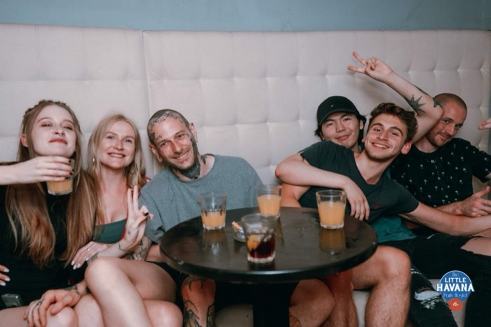 Joshua: at right with friends on couch, Little Havana party hostel.