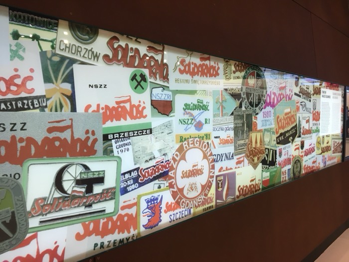 Wall collage of Solidarnosc logos at European Solidarity Centre