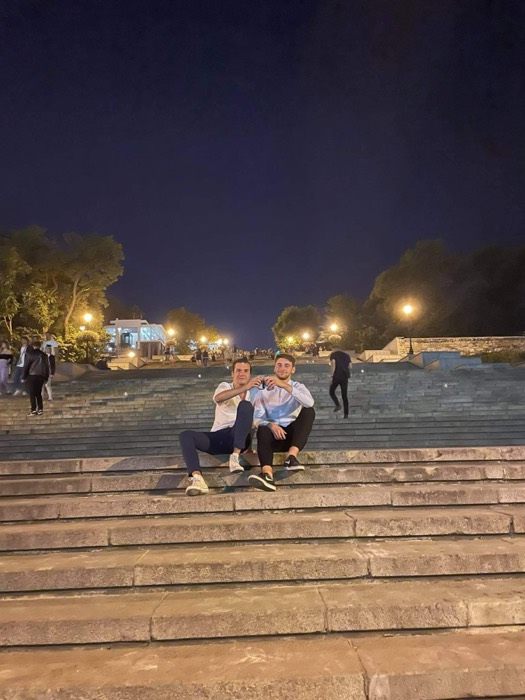 Joshua: with friend on the floodlit Potemkin Stairs at night.