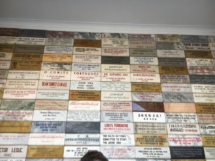 Wall of worldwide Juche Idea study-group dedication plaques
