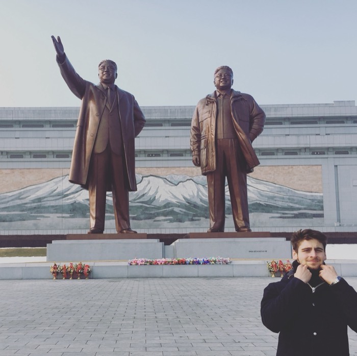 Joshua: posing under Mansudae Grand Monument bronze leader statues