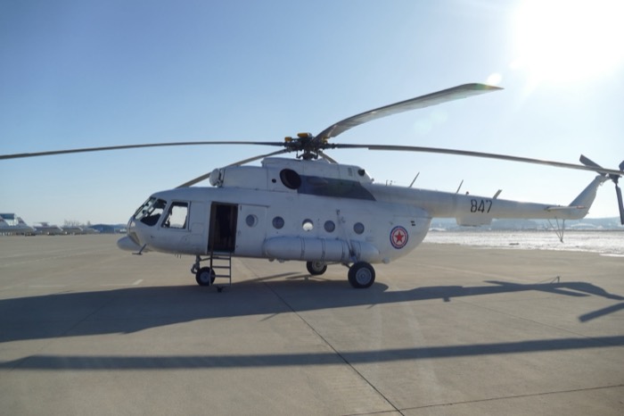 North Korean Mi-8 helicopter no.847 with red star roundel parked on tarmac