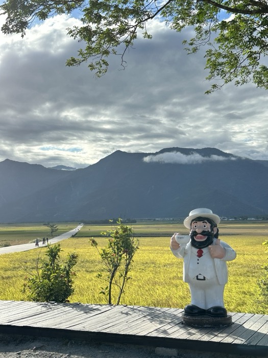 Mr. Brown coffee mascot statue overlooking Brown Avenue and mountains