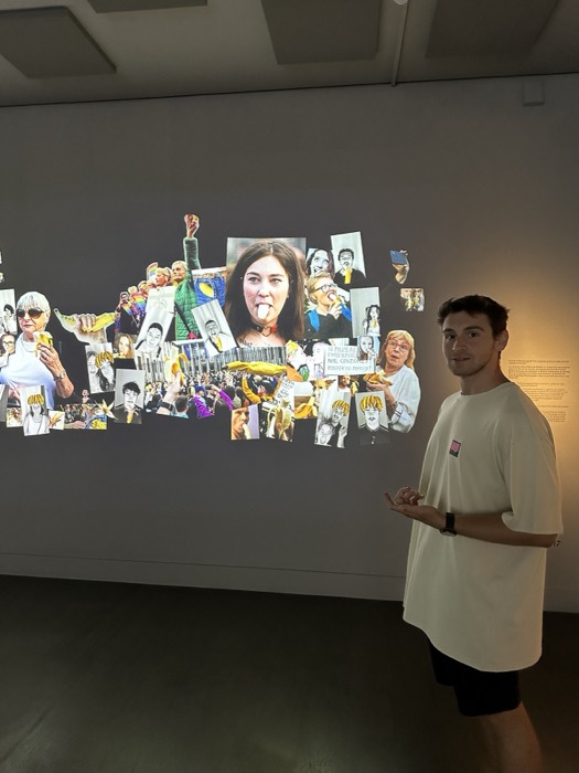 Joshua: beside banana-protest photo collage in art museum