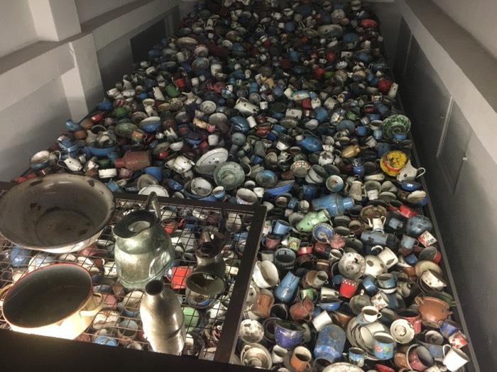 Pile of confiscated enamel cups and pots, Auschwitz museum